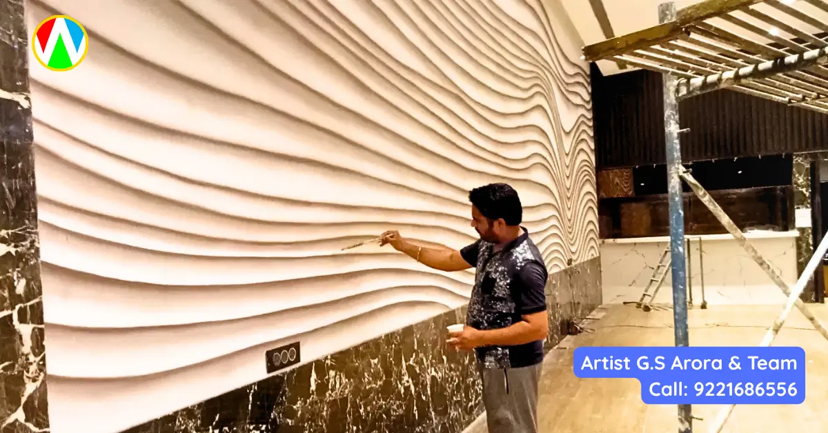 Artist G.S. Arora putting final touches on 3D wave wall art Mumbai restaurant