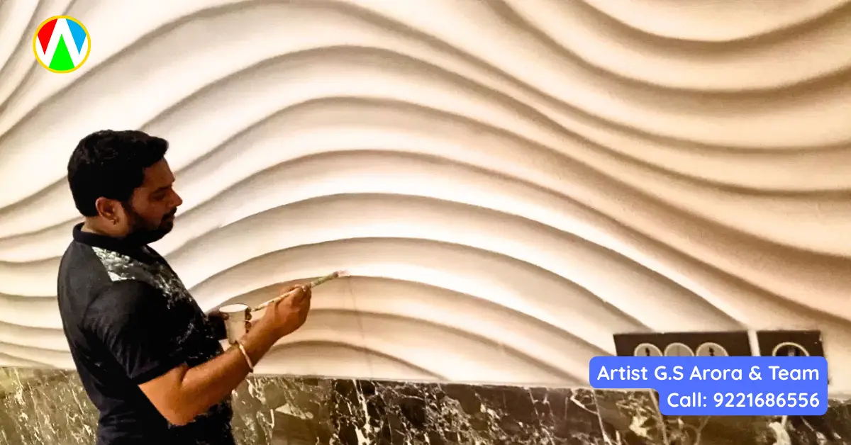 Artist G.S. Arora working on 3D wave wall art on scaffolding — Mumbai restaurant
